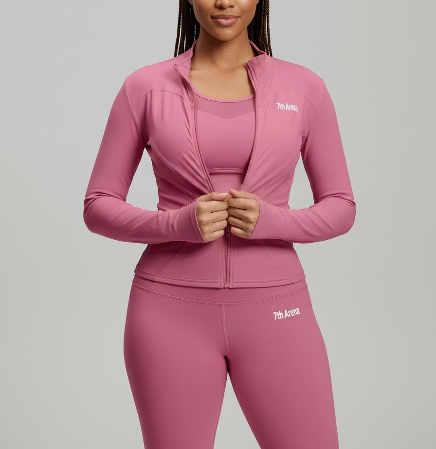 Woman wearing a pink athletic outfit with '7th Avenue' branding on a gray background