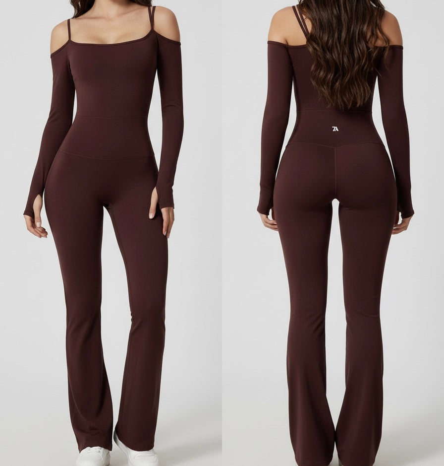A woman wearing the Star Connect Jumpsuit, a sleek, form-fitting athletic one-piece designed for working out and everyday style