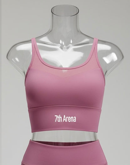 Pink sports bra on a mannequin with '7th Arena' branding against a gray background