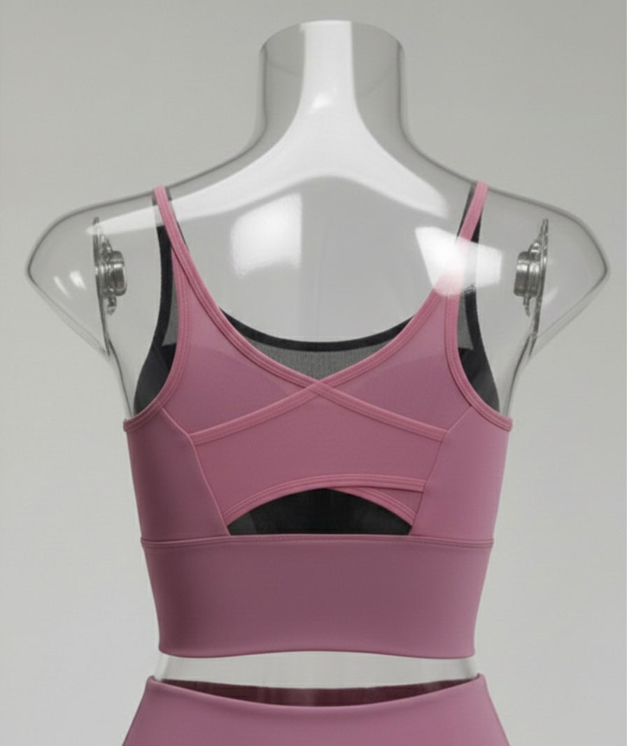 Purple sports bra on a mannequin with a gray background