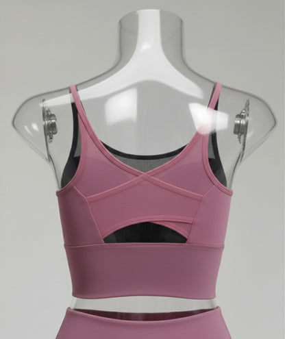 Purple sports bra on a mannequin with a gray background
