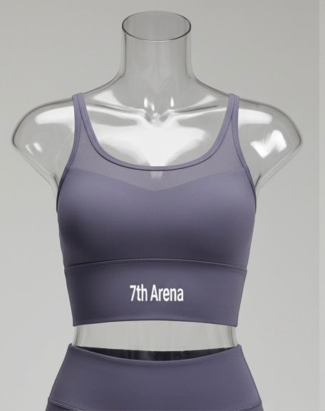 Purple sports bra with '7th Arena' branding on a mannequin against a gray background