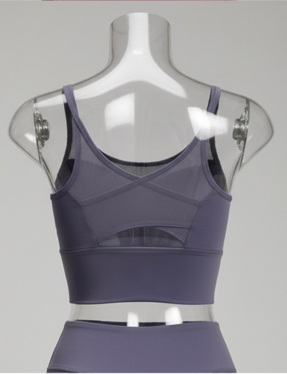 Purple sports bra on a mannequin against a gray background