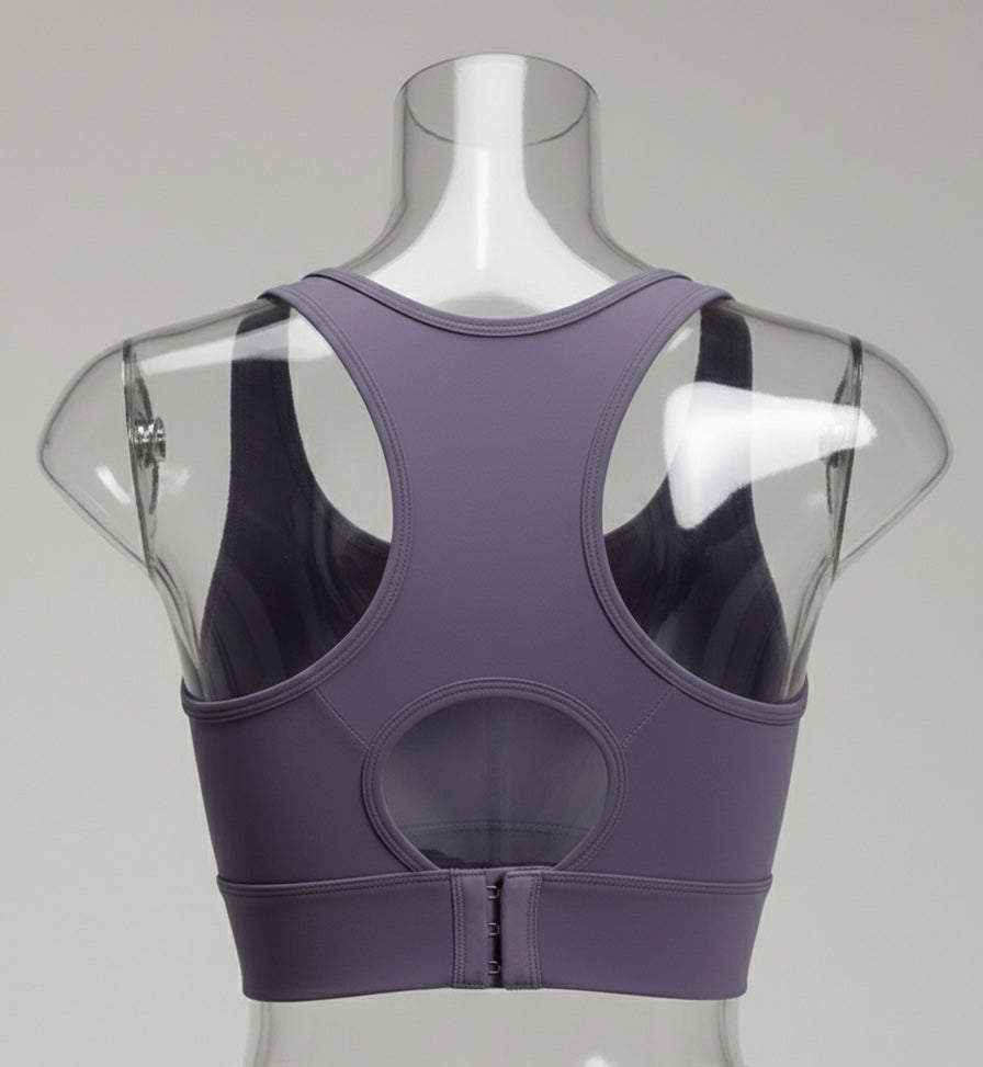 Purple sports bra on a mannequin with a clear back panel against a gray background