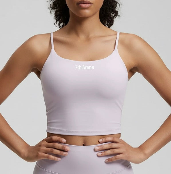 Person wearing a light purple sports bra with '7th Arena' branding on a light gray background