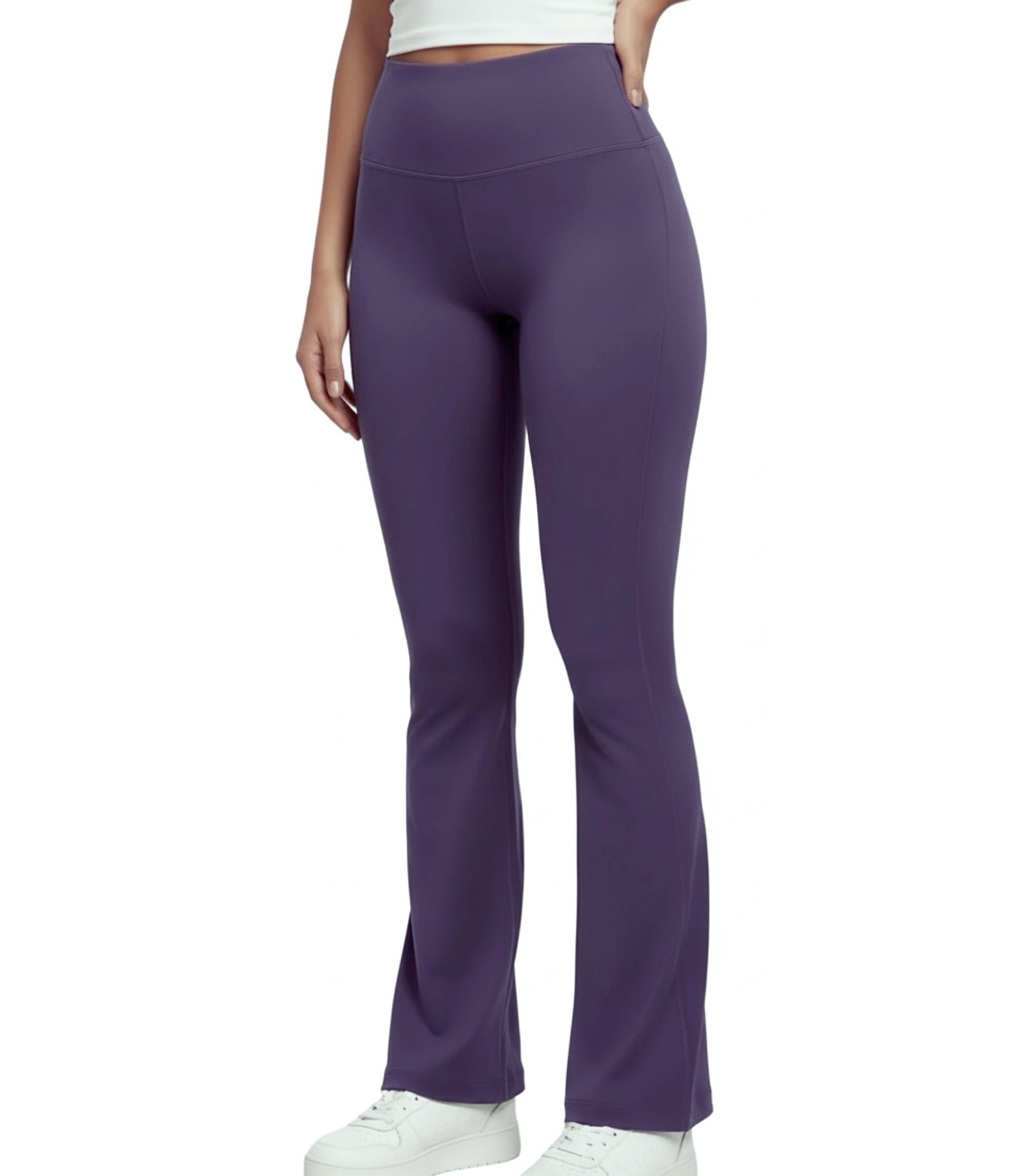 Purple flare leggings worn by a person on a white background