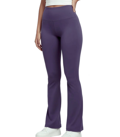 Purple flare leggings worn by a person on a white background