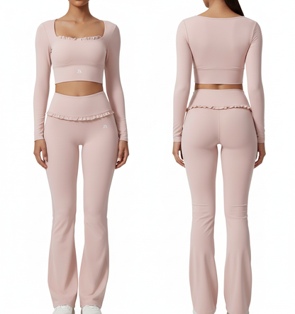 Pink athletic outfit set with long-sleeve cropped top and leggings on a white background