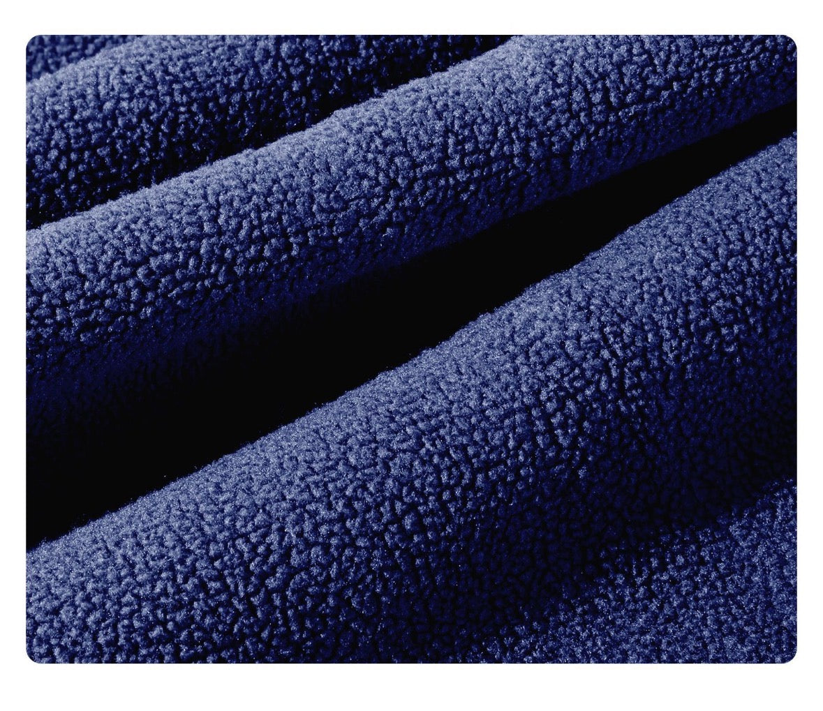 Close-up of blue textured fabric with a gradient effect