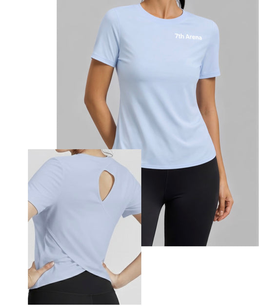 Light blue athletic shirt with '7th Arena' logo, worn by a person, on a gray background.