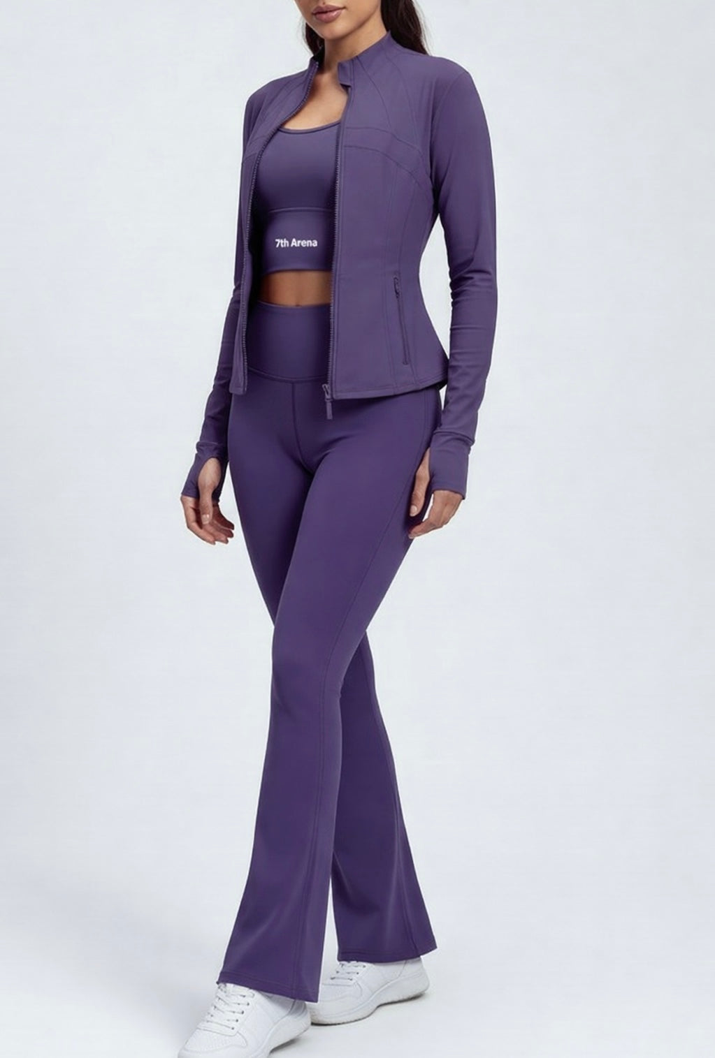 Person wearing a purple athletic outfit set on a white background