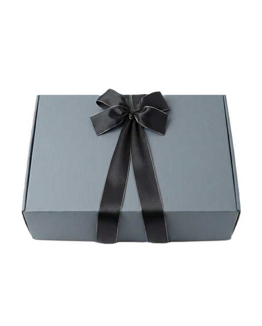 Gray gift box with a black ribbon on a white background